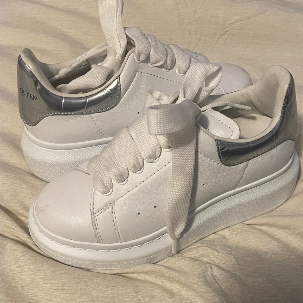 White and Silver Sneakers. Minor scuff on front. Super white. US Boys 10.
